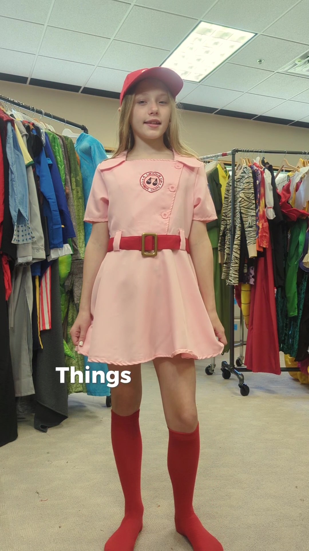 This Child A League of Their Own Dottie Costume will let your girl be a feminist icon! This costume features Pink baseball uniform, red belt. red knee-high socks, and red hat to complete this women's baseball look.